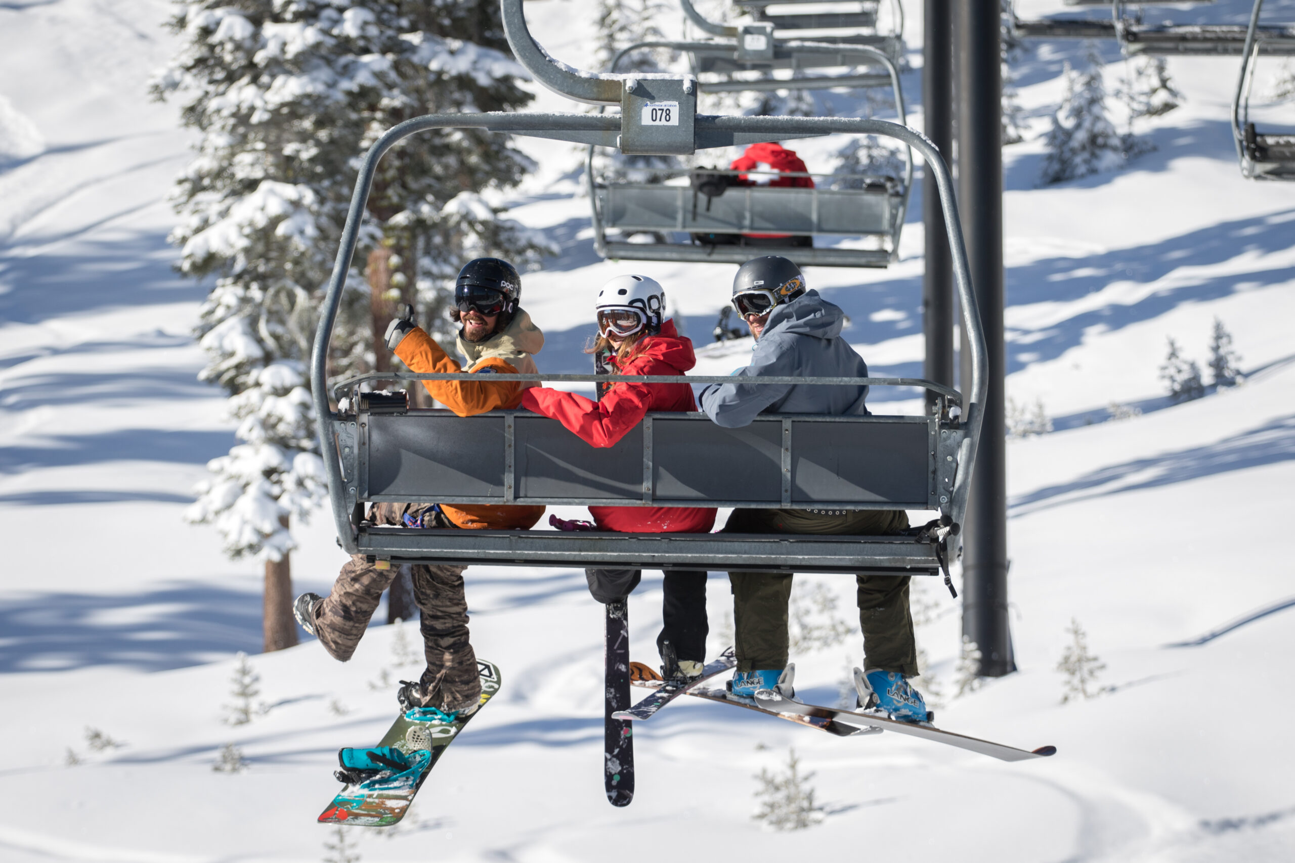 Skiers on a chairlift at Northstar