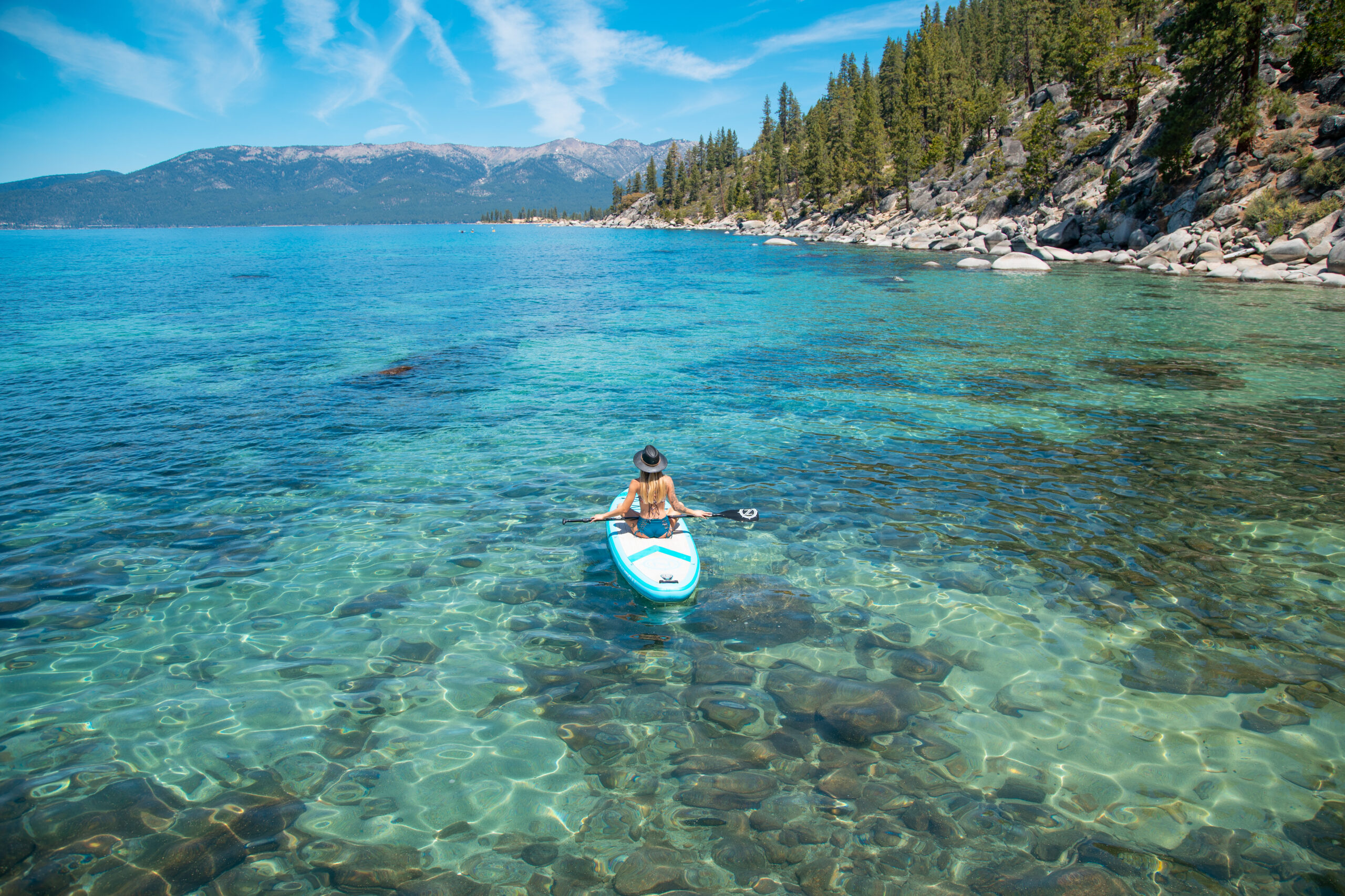 Paddleboarding on the clear water of Lake Tahoe